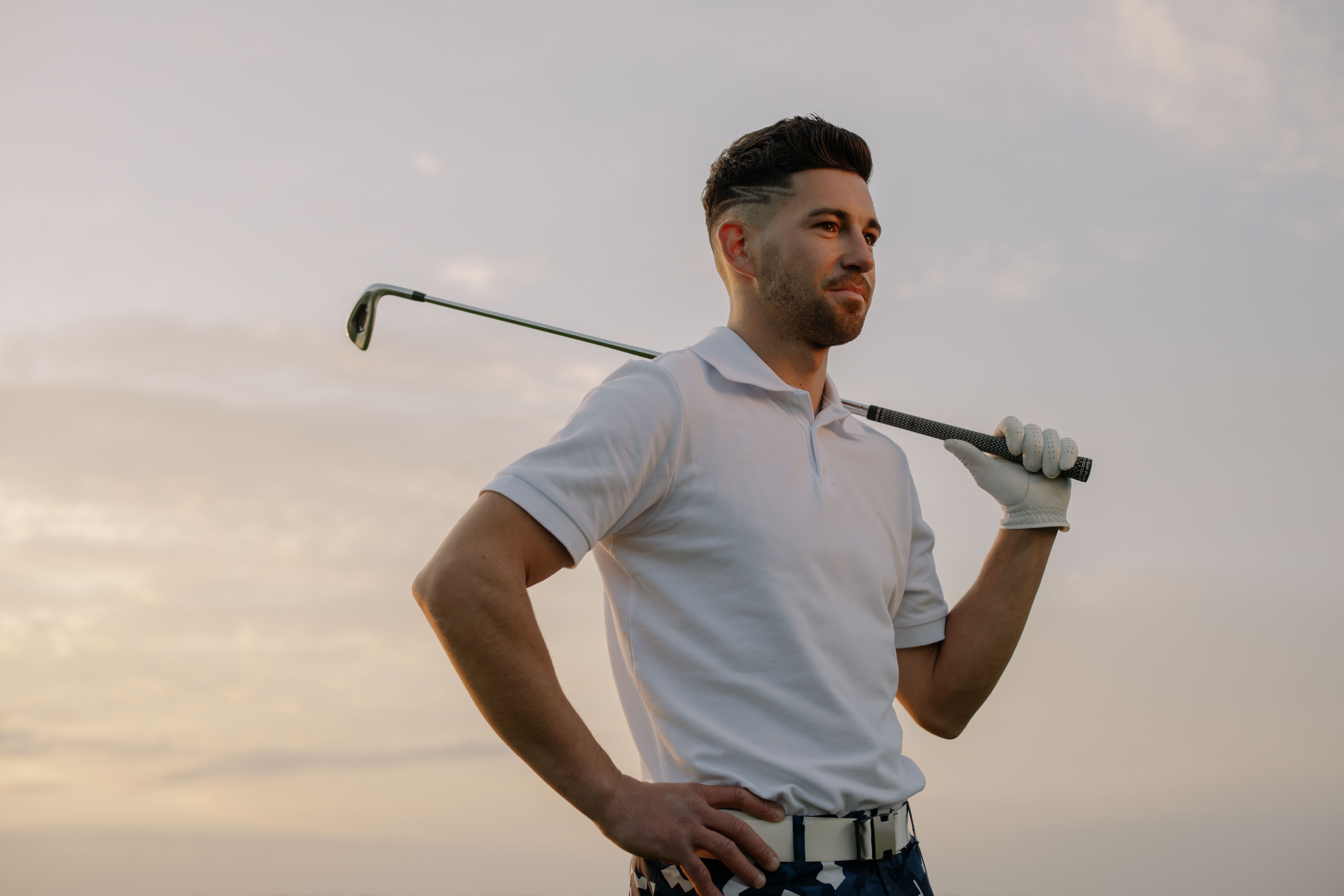 Golfer smiling while checking their phone